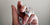 wonams hand wrapped in measuring tape