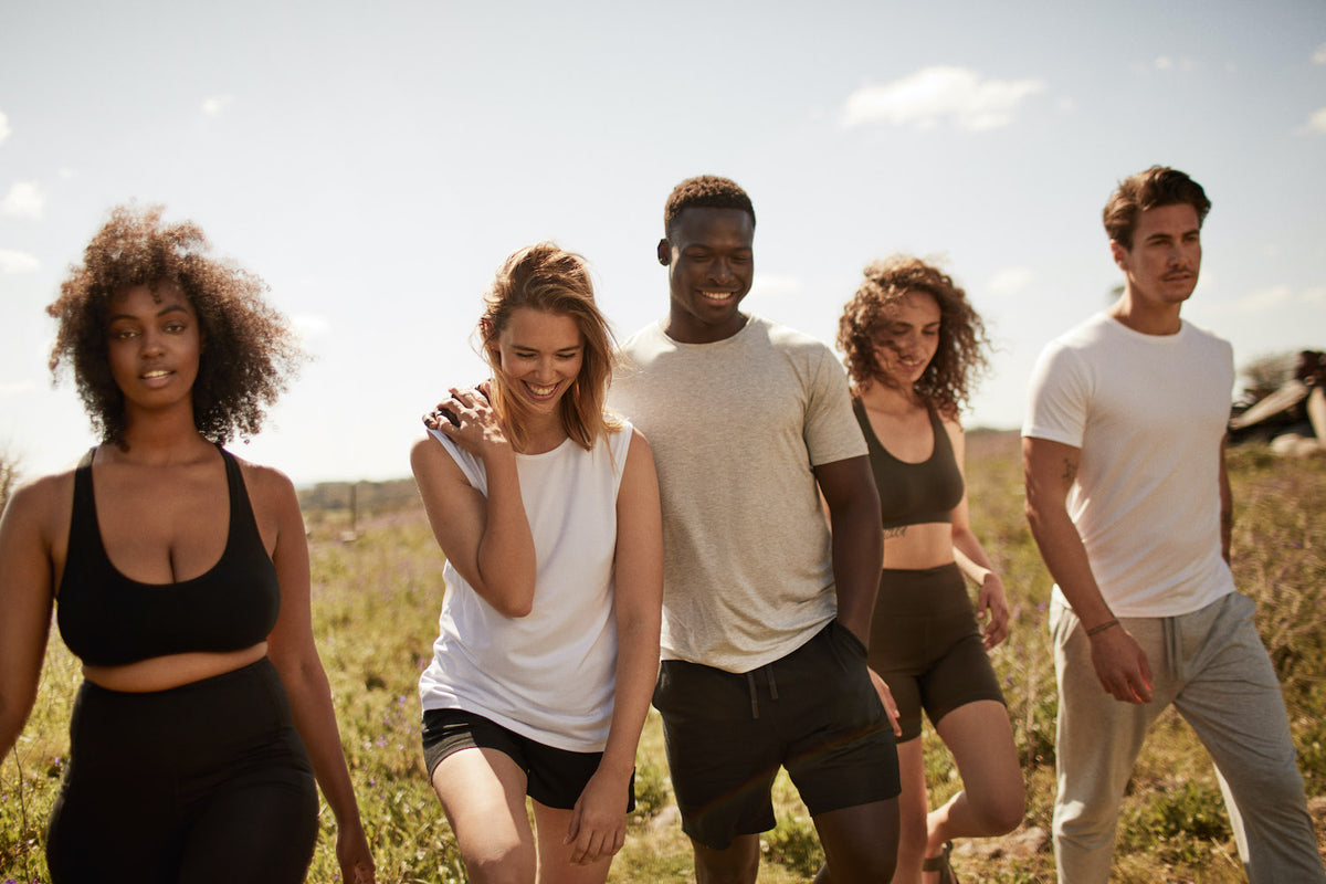 group of young people in hte fields, wearing bamboo underware