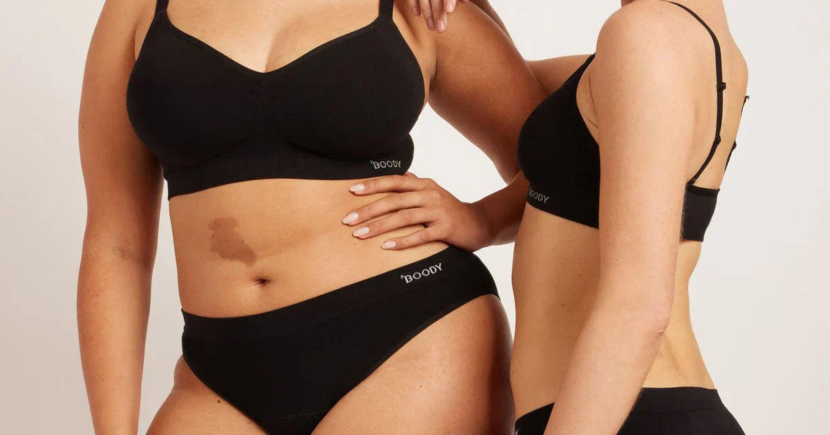 Women modelling black Boody bamboo period underwear with soft seamless bras, highlighting leakproof protection and stretchy everyday comfort.